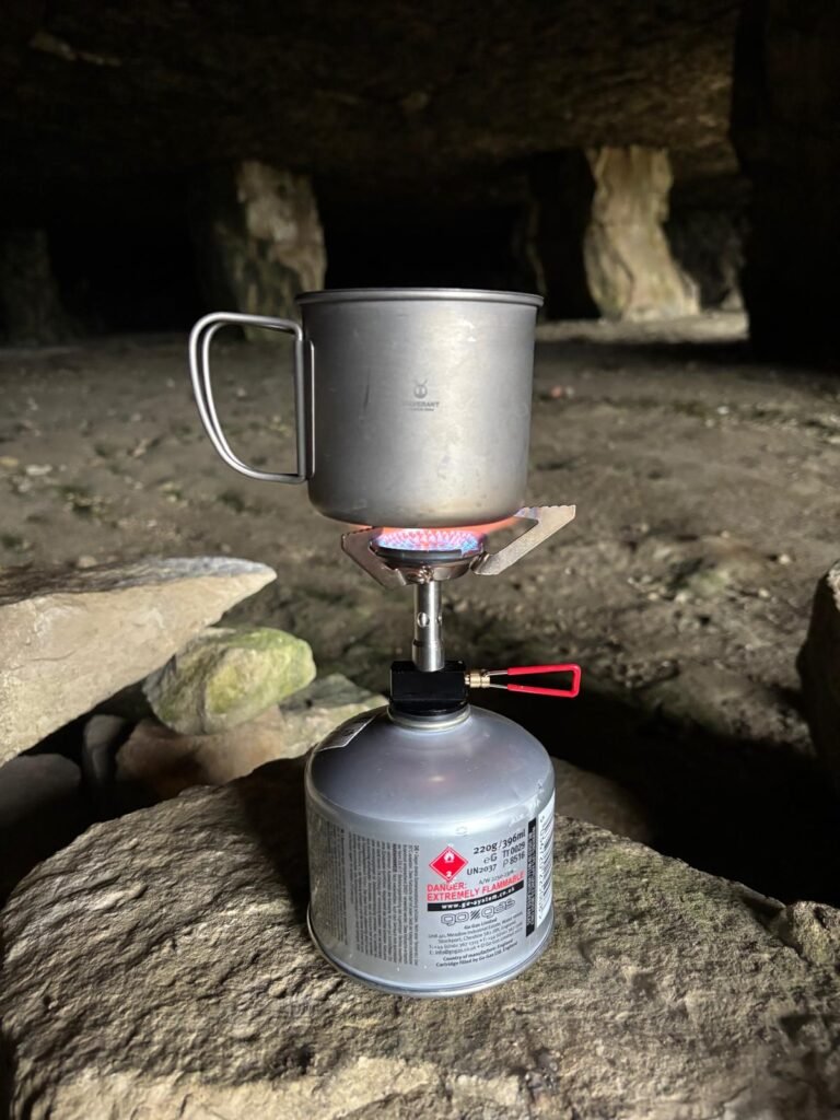Making coffee inside Winspit Quarry cave using a SilverAnt cup during a UK wild camping trip