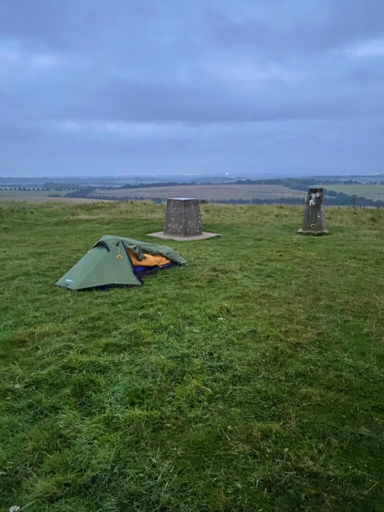 oex phoxx 1 v2 tent low profile setup on exposed hillfort below trig point