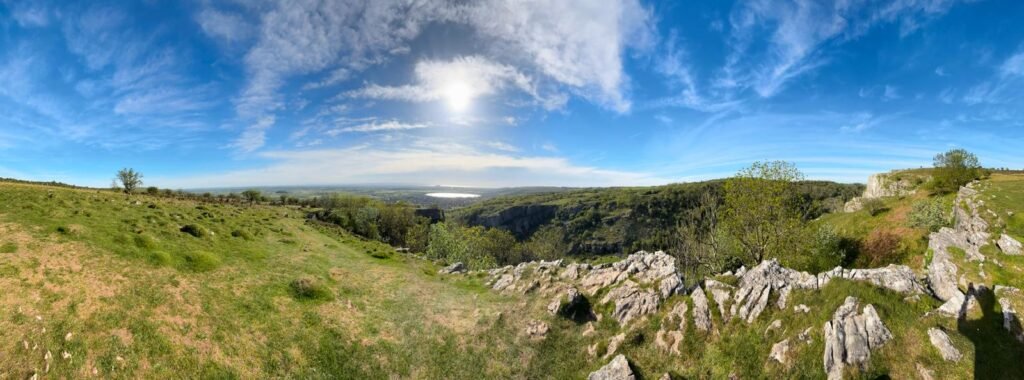 Cheddar Gorge panorama from the cliff top with reservoir and Somerset countryside in the distance