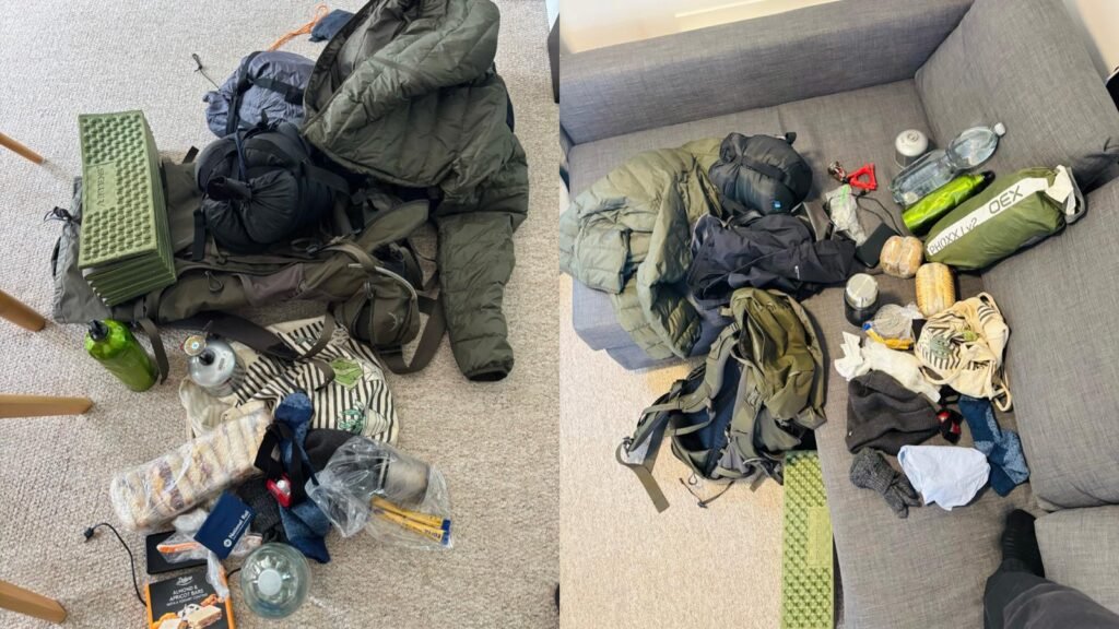Camping gear laid out on a living room sofa and floor before a trip